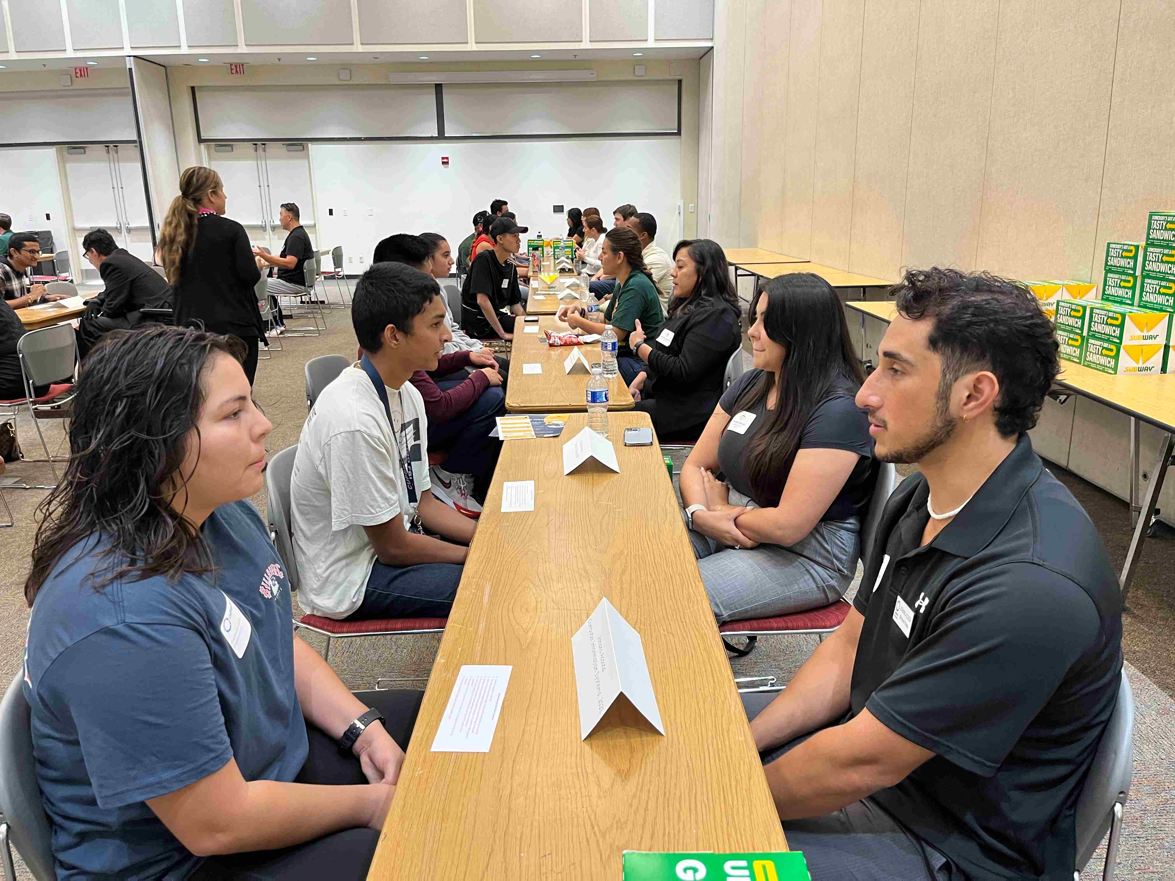 alumni and students engaged in conversation