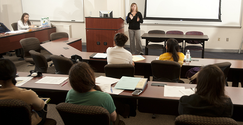 Alumna teaching in a College of Business Class