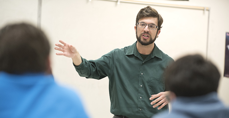 Alumnus teaching in a classroom