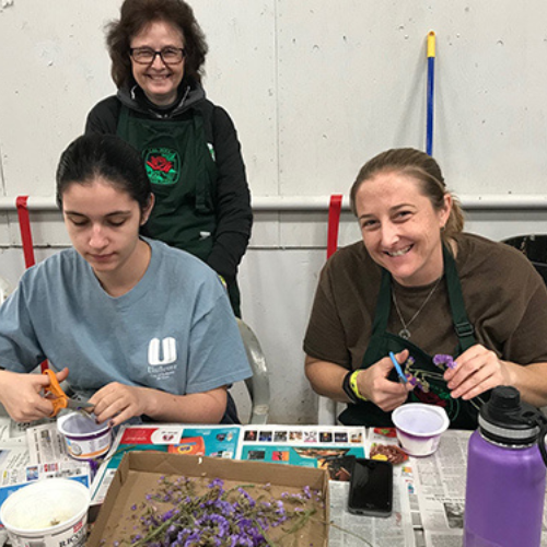 group working on crafts smiling