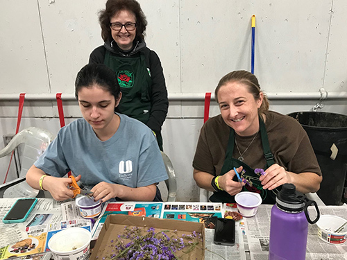 Rose Float Alumni Chapter helping with decorations at Rose Float Deco Day.