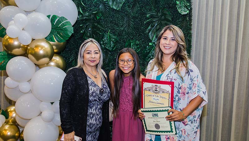 Hilda Solis Scholarship receipient receiving award