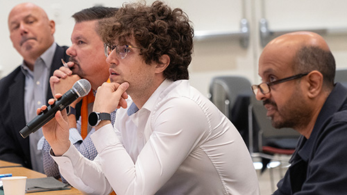 AI hackathon judges sitting at a table