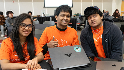 AI hackathon participants sitting at a table