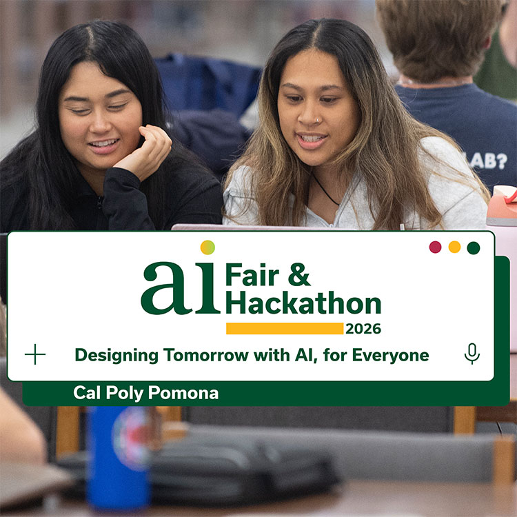 students studying at a table with laptops