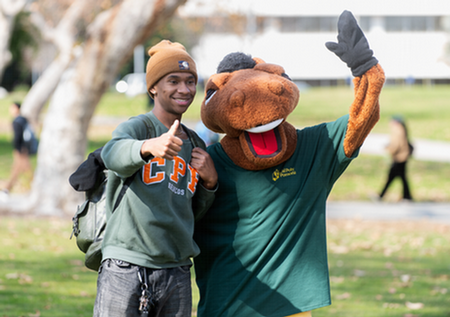 billy bronco in quad with student