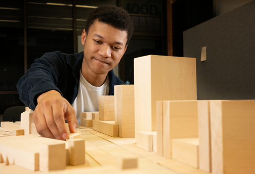 architecture student with building blocks 