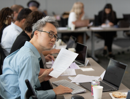 faculty working at assessment event