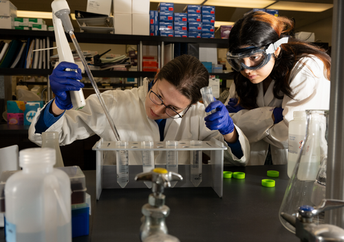 student practicing in chemistry lab