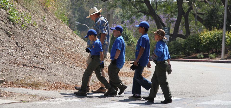 Dr. Brown touring the Boy Scouts while crossing the streets