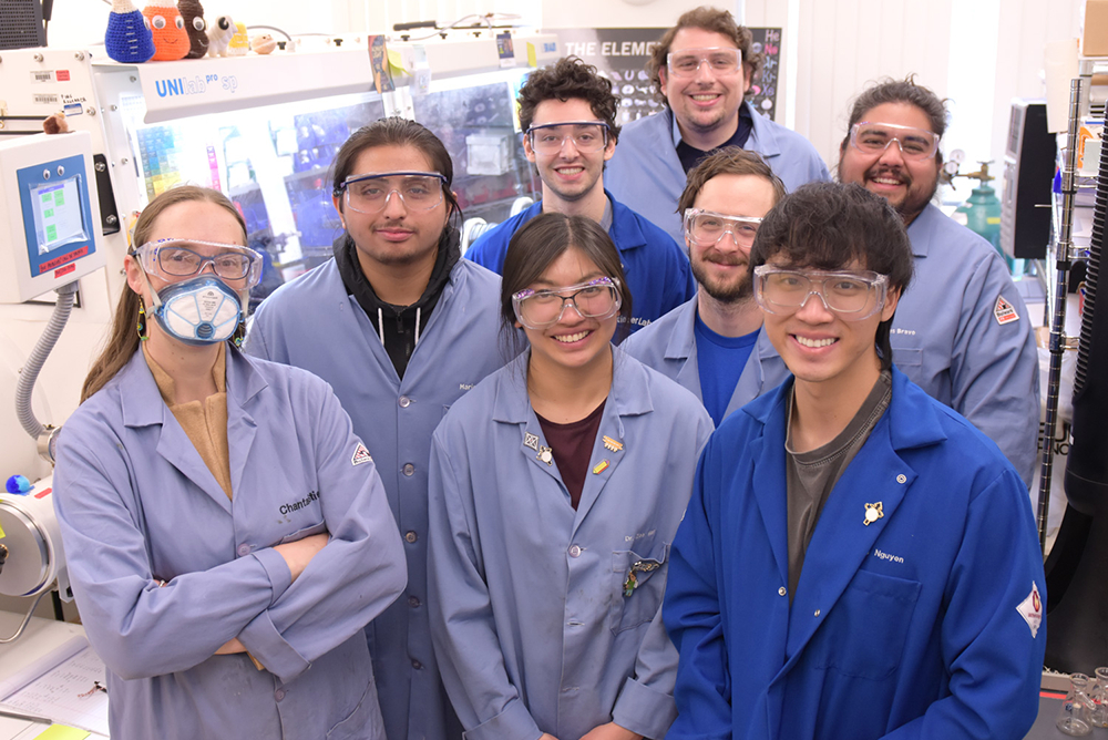 Professor Chantal Stieber and a group of students in her lab class.