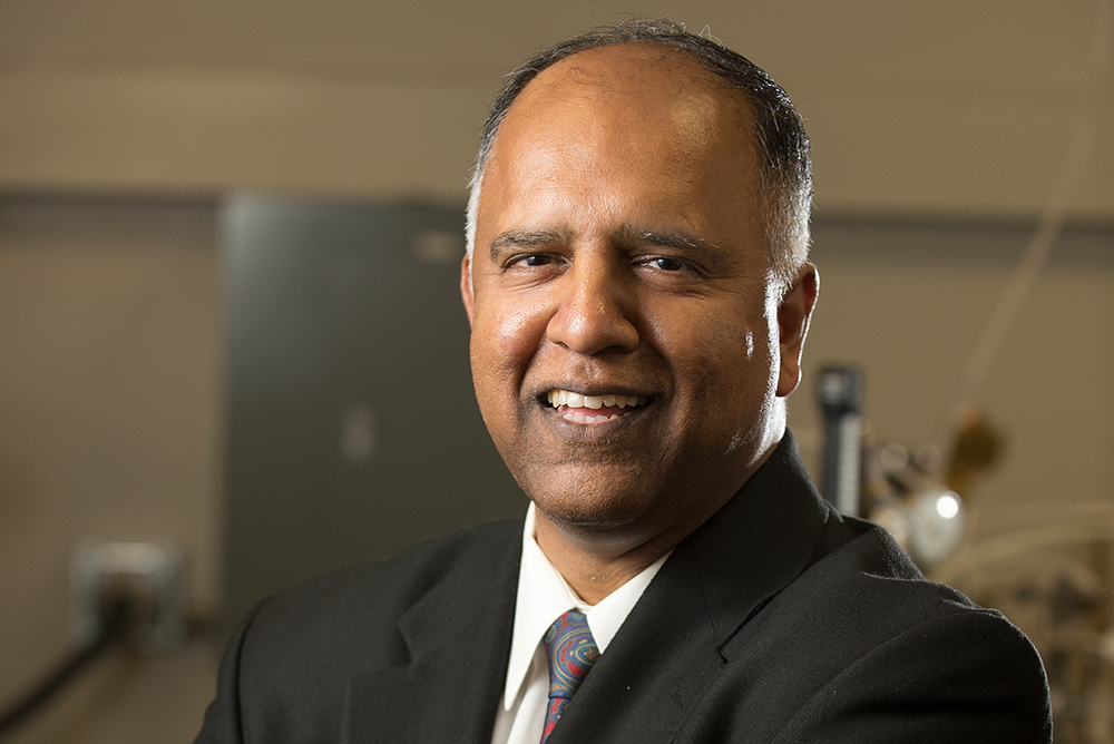 Professor Vilupanur Ravi smiles during a classroom lecture.