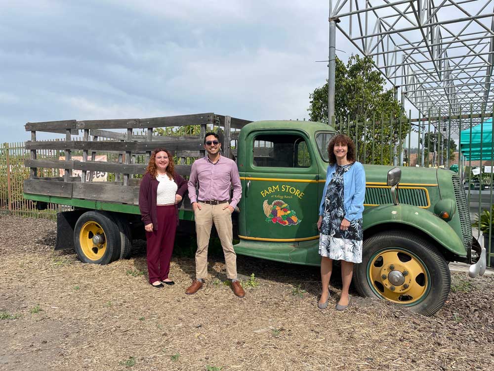 In the photo: Leslie Luqueno, Jonathan Perez, and Lisa Kessler standing by the Farm Store truck