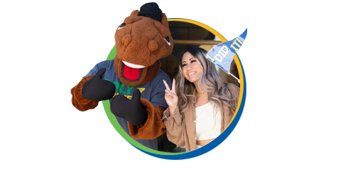 Billy Bronco and a student signaling peace