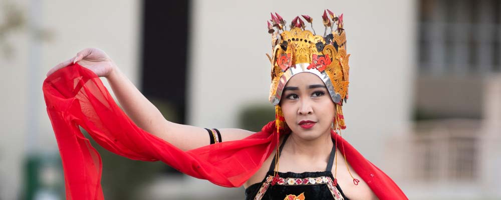 A performer poses during a Lunar New Year celebration on campus