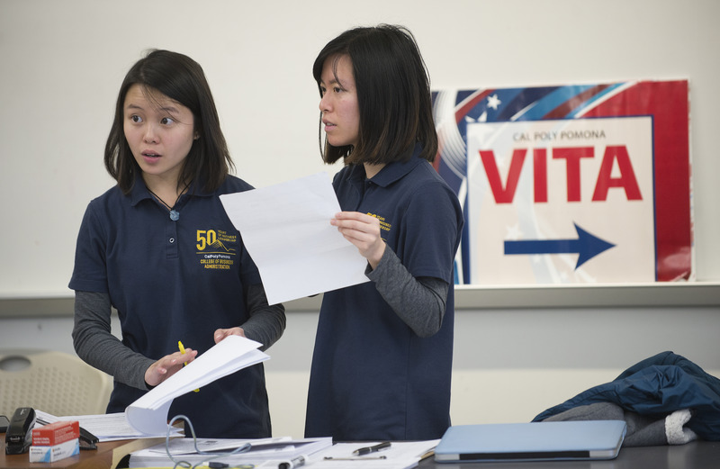 Students welcome guests during a VITA clinic