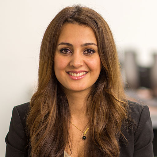 Female student smiling in front of class