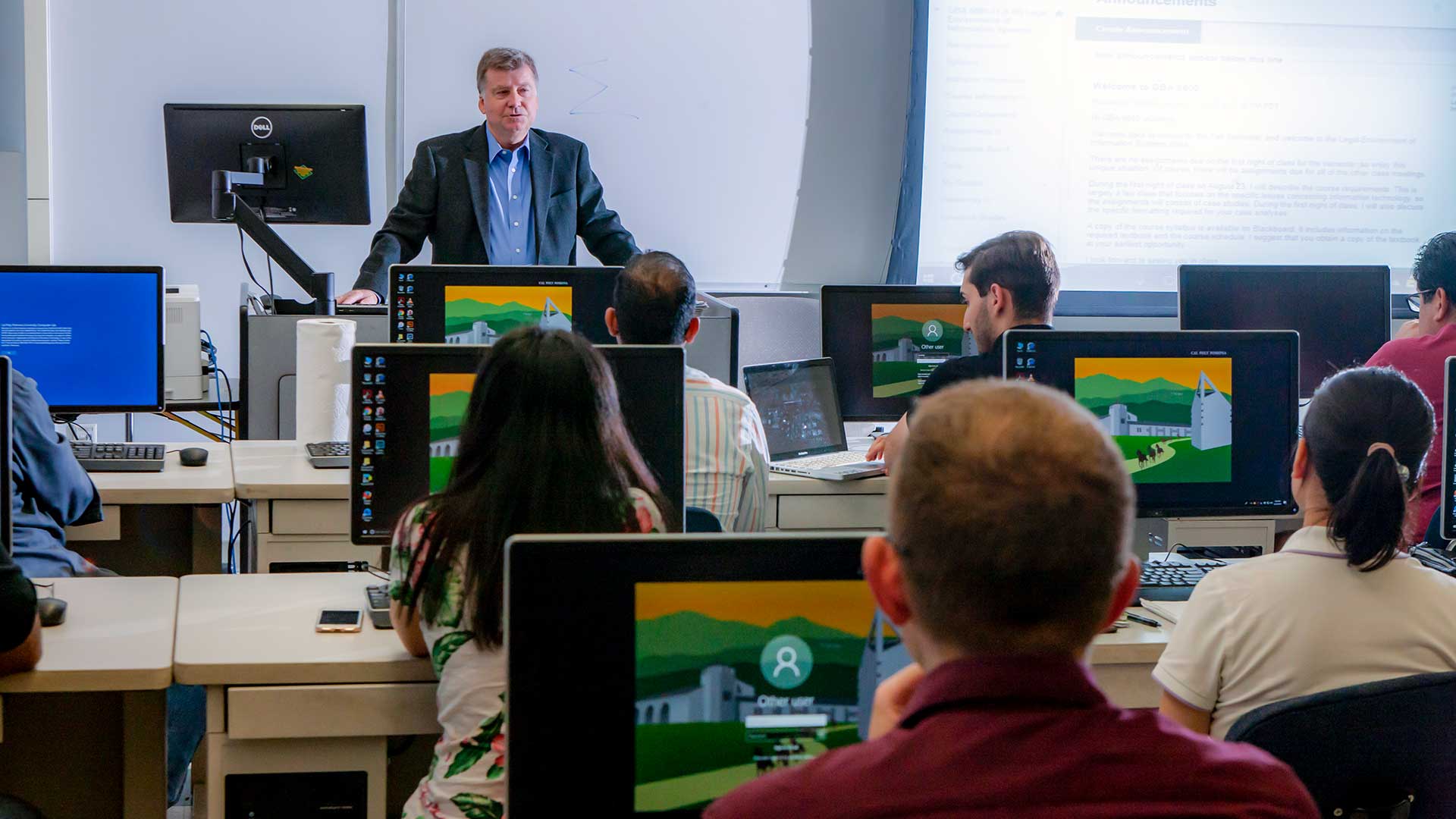 Male professor in front of graduate studies forensics class