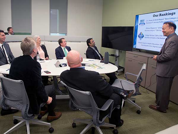 Man in suit giving presentation