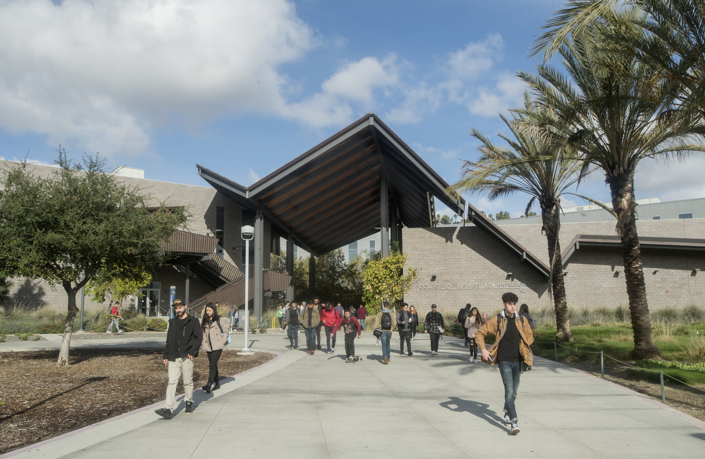 College of Business Building and Student walking