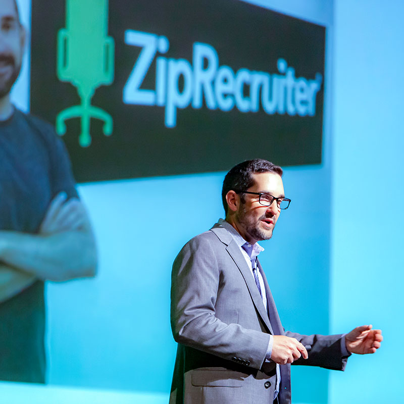 Ziprecruiter Co-Founder Ian Siegel during his Dean's Leadership Forum on stage speaking