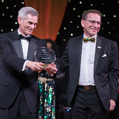Avanade being presented corporate partner award by Dean Rolland during 50th Gala