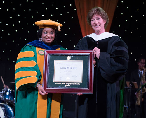 President Coley presenting honorary doctorate to Diane Miller