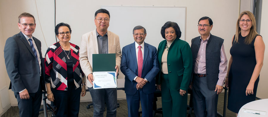 Group photo of Dean Rolland, Tara Sethia, Ed He, Sheth, President Coley, Nirmal Sethia and MHR Professor Aytung at award ceremony