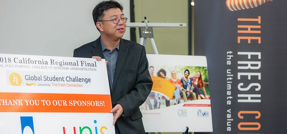 Ed He presenting winners at the 2018 Global Student Challenge