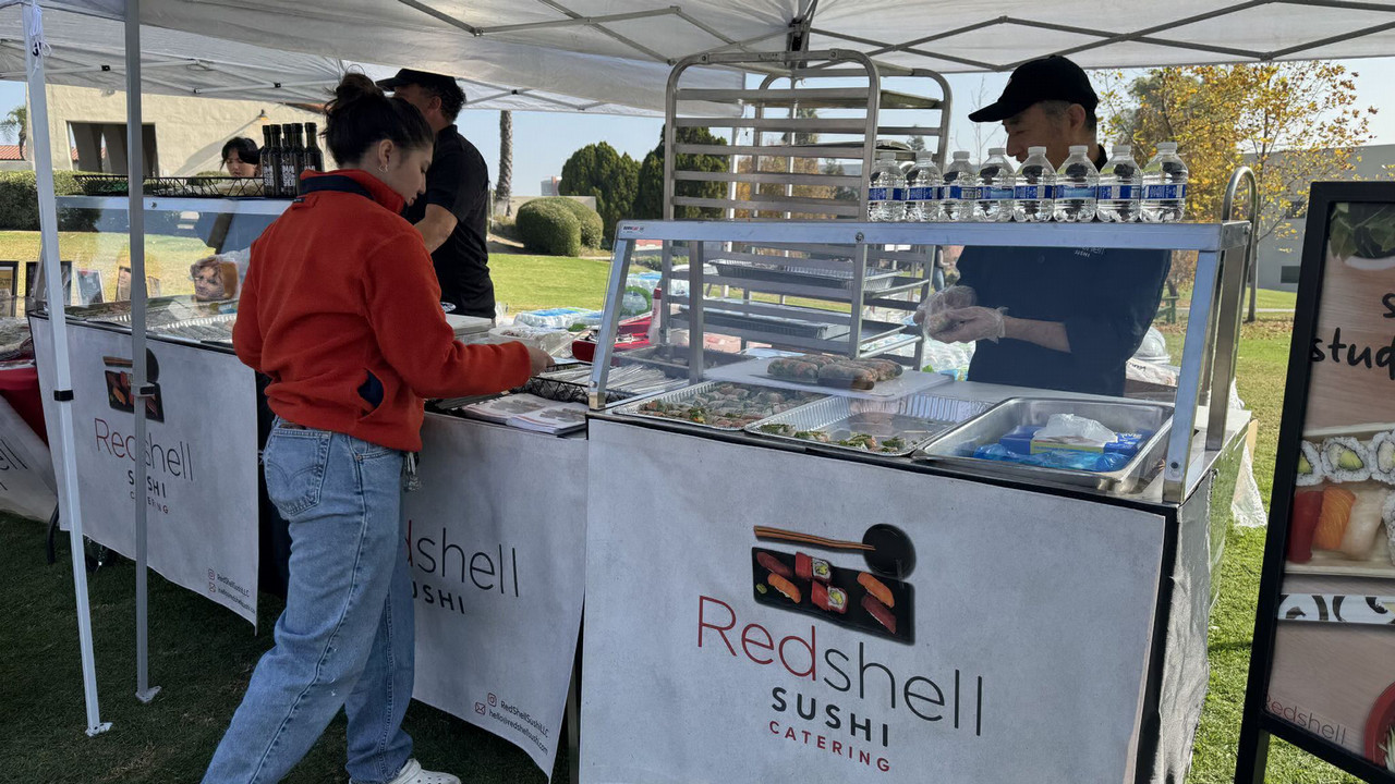 Student working at Redshell Sushi