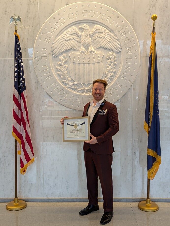 Albert Fattal as Federal Reserve Board of Governors