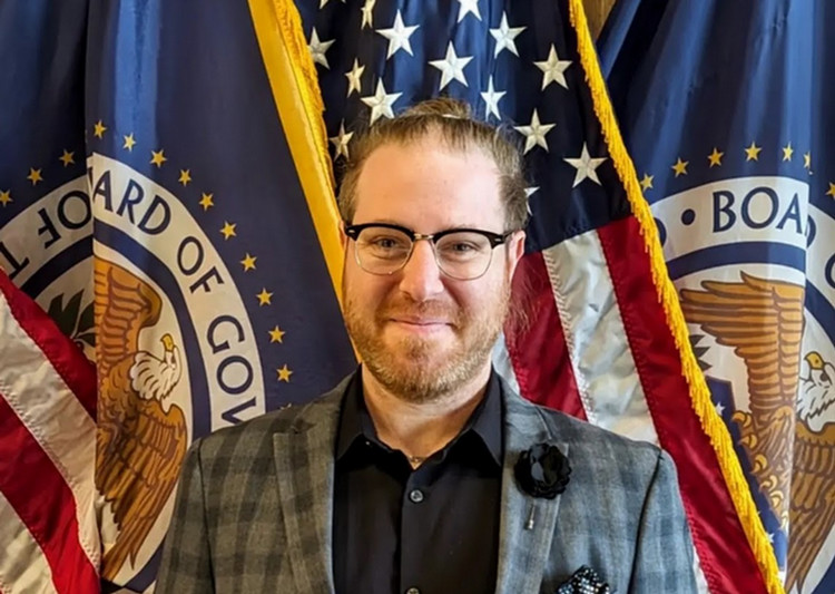Albert Fattal in front of flag