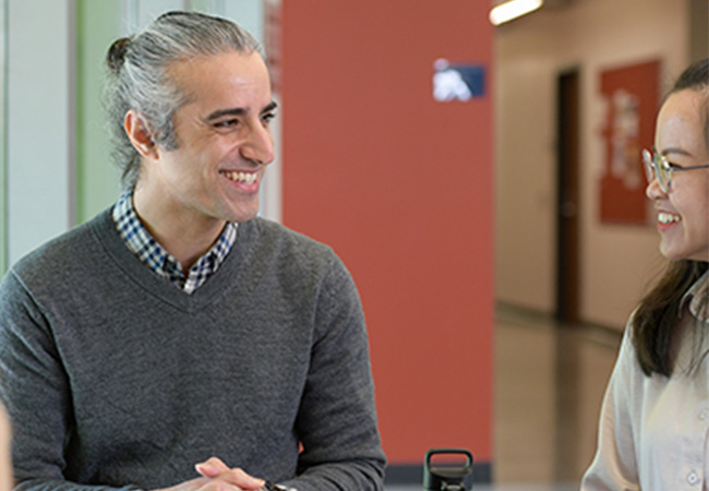 Dr. Alireza Yazdani Helping student