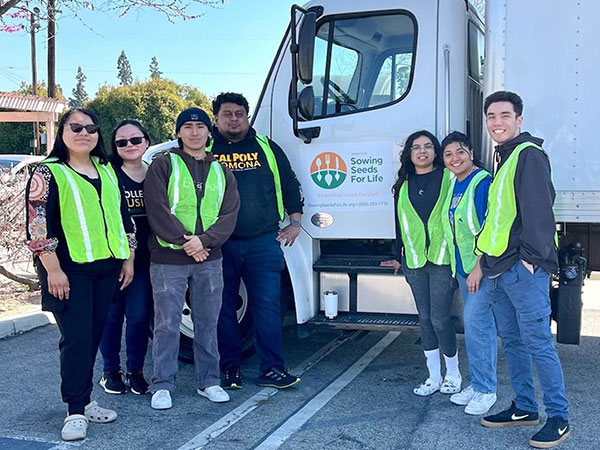 Student at Sow seeds for life event in front of truck
