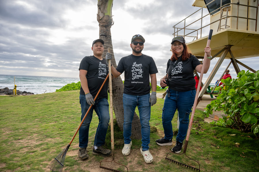 Three MBA Students at Kuaui helping with cleaning