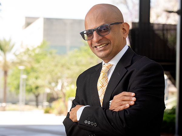 Dean Krishnamurthy in front of CBA canpoy