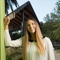 Dr. Kristen Schiele in front of CBA building