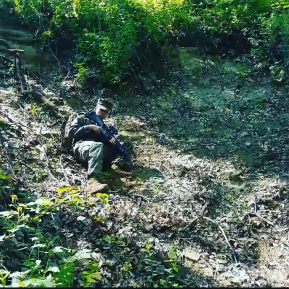 Assistant Professor Uriel Saldivar in Army training