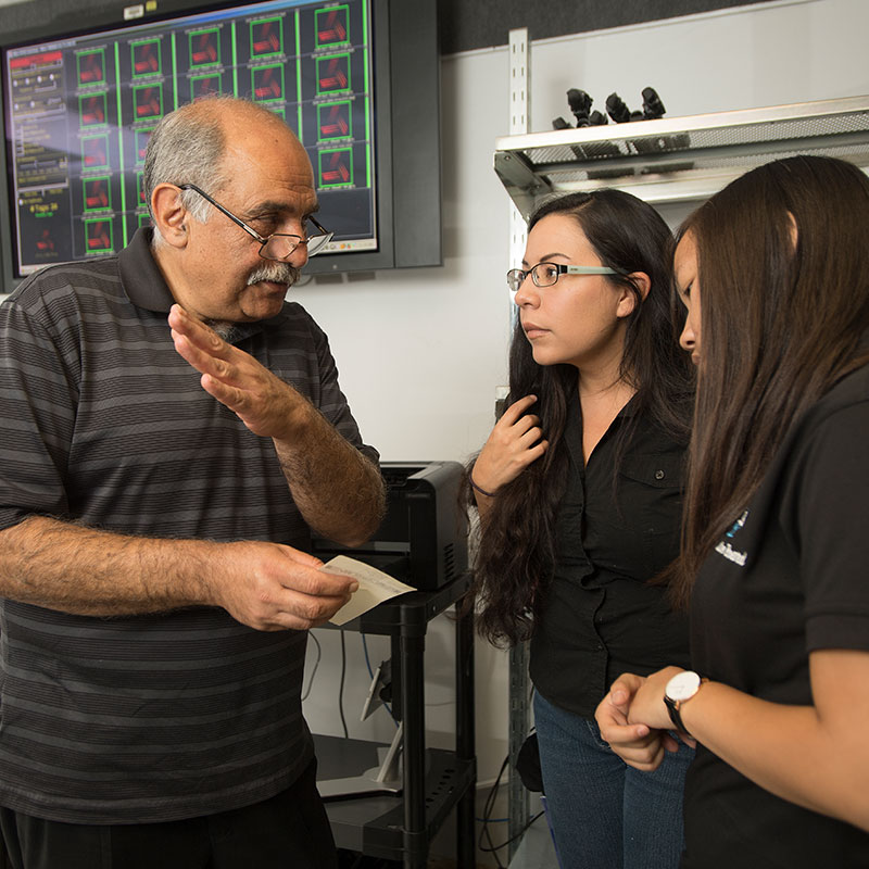 Professor explaining RFID to students in the SCOT lab