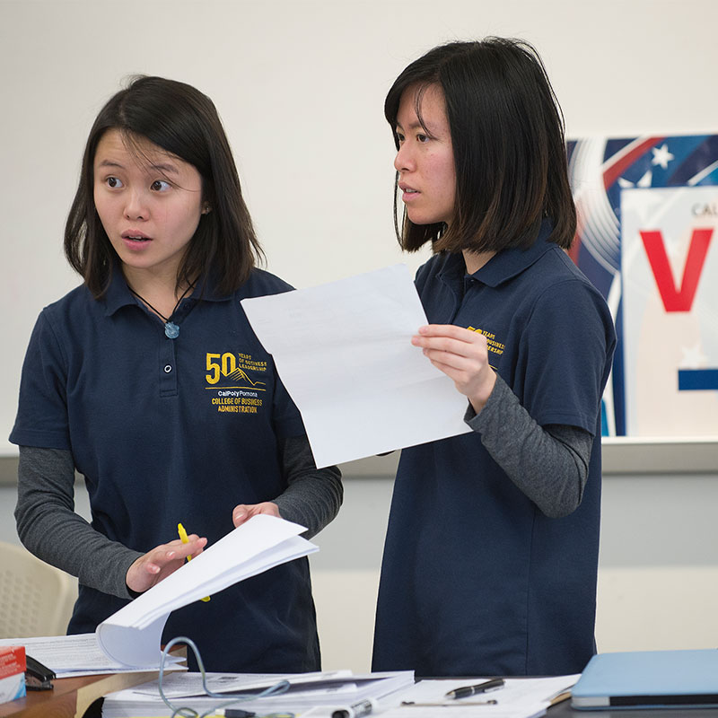 Students checking in community members during Tax Day