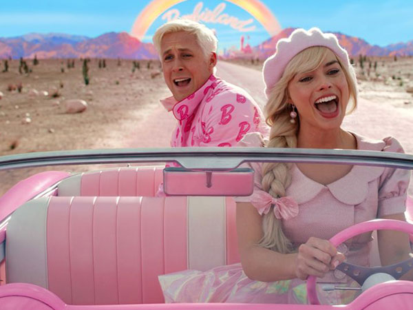 Barbie Movie screen capture with Barbie and Ken in corvett