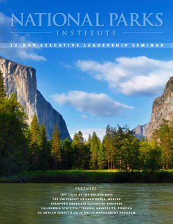 Cover of National Parks Institute 10-Day Executive Leadership Seminar featuring lake with mountains, trees and bright blue sky 