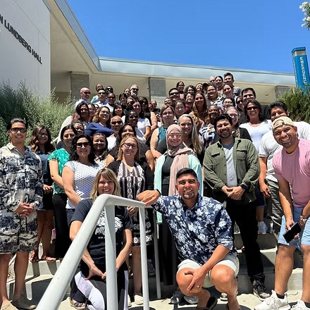 Cohort 12 & 13 standing on stairs.