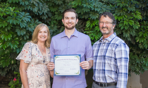 graduate holding certificate