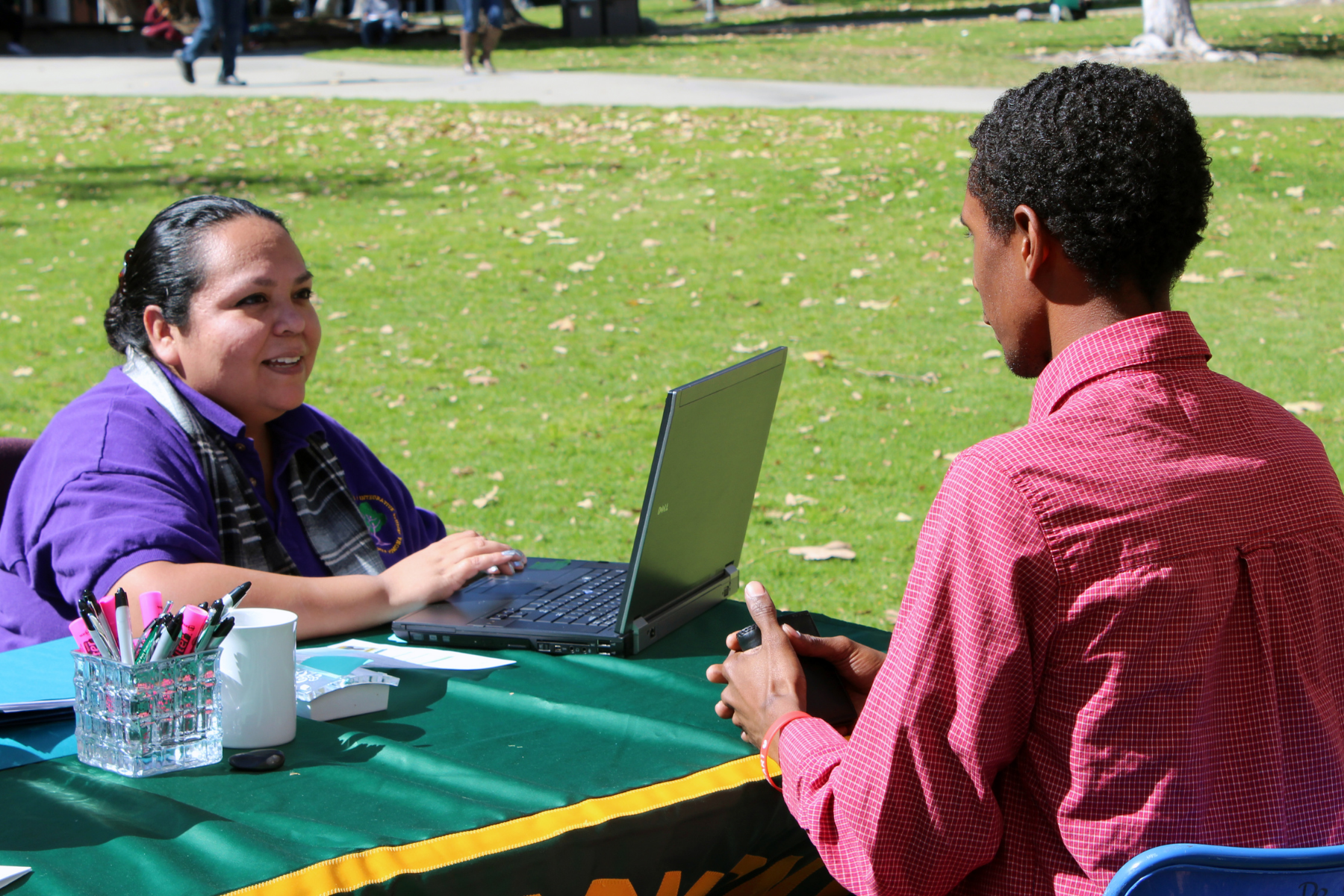 Two female students consulting with a specialist