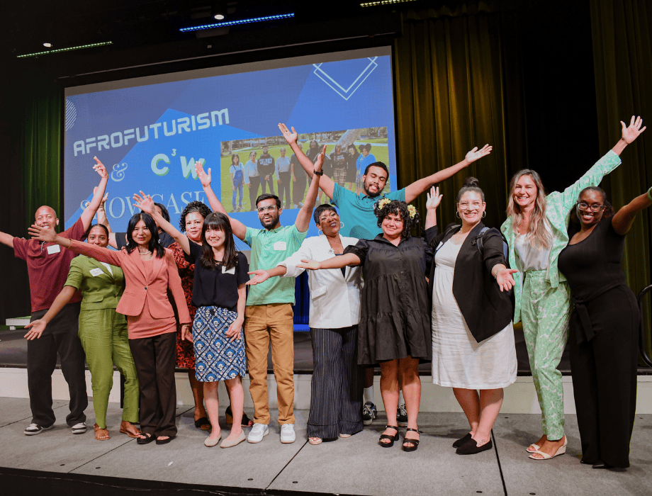 Group of students standing and smiling for a photo. 