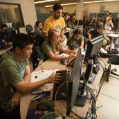 students in front of computer