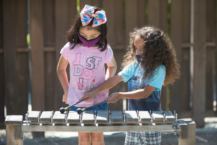 Children playing an instrument