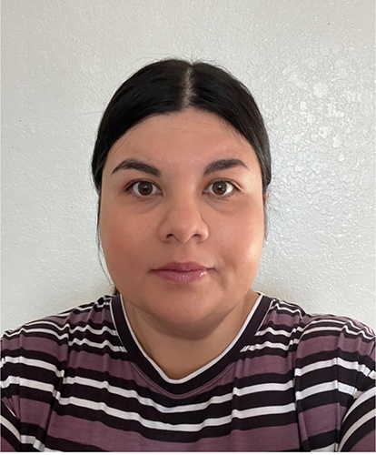 Headshot of Diana in white and brown stripped shirt