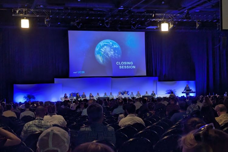 Jack Dangermond and panel of Esri employees on stage at closing session